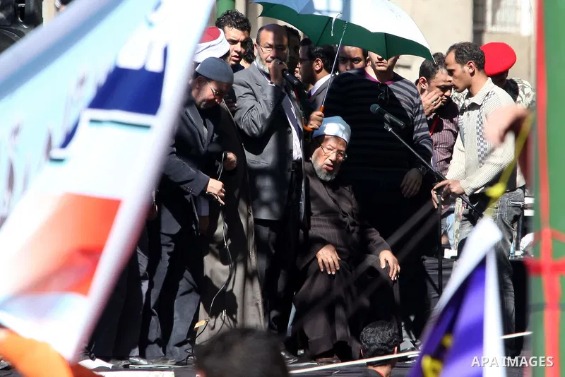 Egyptian cleric Sheik Youssef el-Qaradawi leads Friday prayers in Tahrir Square in Cairo, Egypt, Friday Feb. 18, 2011. Tens of thousands of flag-waving Egyptians packed into Tahrir Square for a day of prayer and celebrat...
