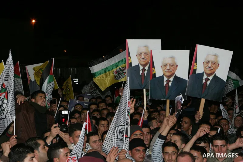 Palestinians take part in a march to show support and pro-security council decision against Israeli settlements, in the West Bank city of Ramallah on Feb. 18,2011. Photo by Thaer Ganaim