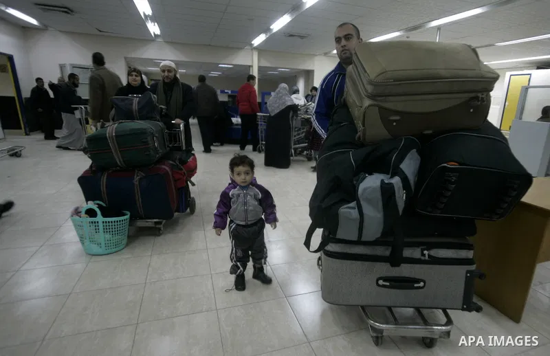 Palestinians Leaving the Hall travelers after coming back from Egypt at the Rafah border crossing between southern Gaza Strip and Egypt, Friday, Feb. 18, 2011. The Rafah border crossing opened on Friday evening for the f...