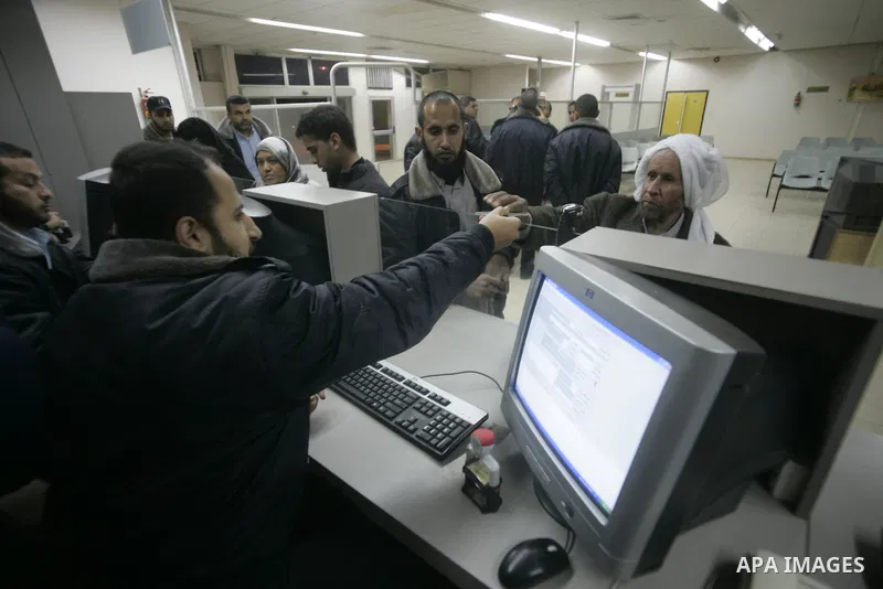 Palestinians Leaving the Hall travelers after coming back from Egypt at the Rafah border crossing between southern Gaza Strip and Egypt, Friday, Feb. 18, 2011. The Rafah border crossing opened on Friday evening for the f...