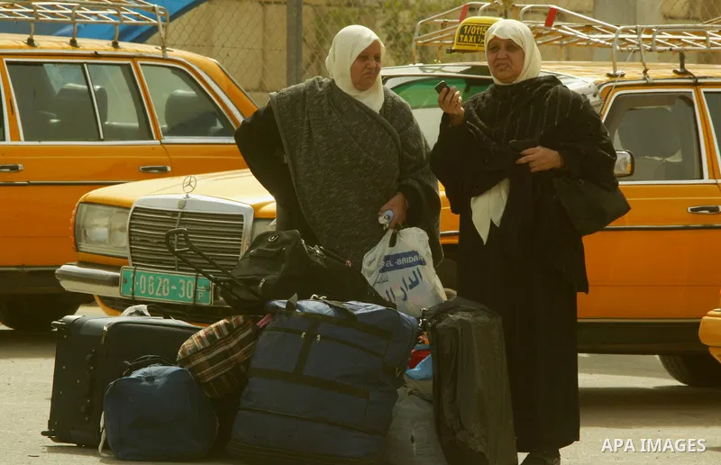 Palestinians returning from Egypt cross through the Rafah crossing on Feb. 19, 2011. The Egyptian authorities reopened the Rafah crossing on its border with the Gaza Stripe on Friday, the first time after the resignation...