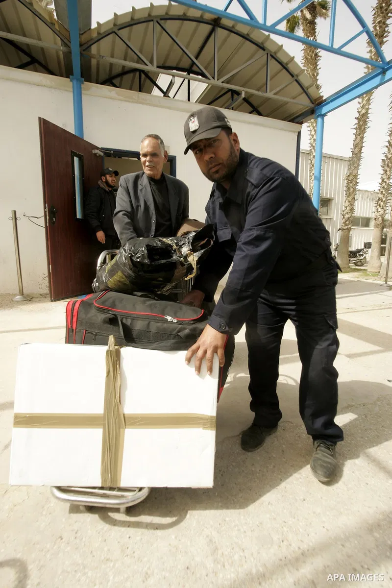 Palestinians returning from Egypt cross through the Rafah crossing on Feb. 19, 2011. The Egyptian authorities reopened the Rafah crossing on its border with the Gaza Stripe on Friday, the first time after the resignation...