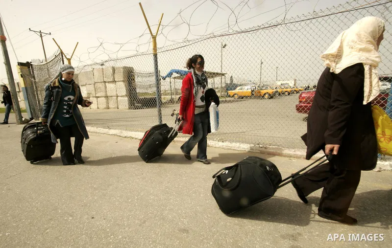 Palestinians returning from Egypt cross through the Rafah crossing on Feb. 19, 2011. The Egyptian authorities reopened the Rafah crossing on its border with the Gaza Stripe on Friday, the first time after the resignation...