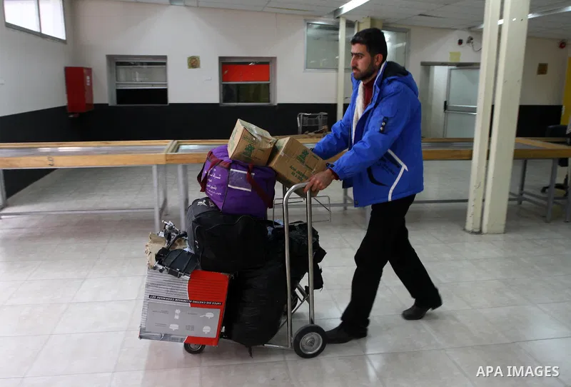 Palestinians returning from Egypt cross through the Rafah crossing on Feb. 19, 2011. The Egyptian authorities reopened the Rafah crossing on its border with the Gaza Stripe on Friday, the first time after the resignation...