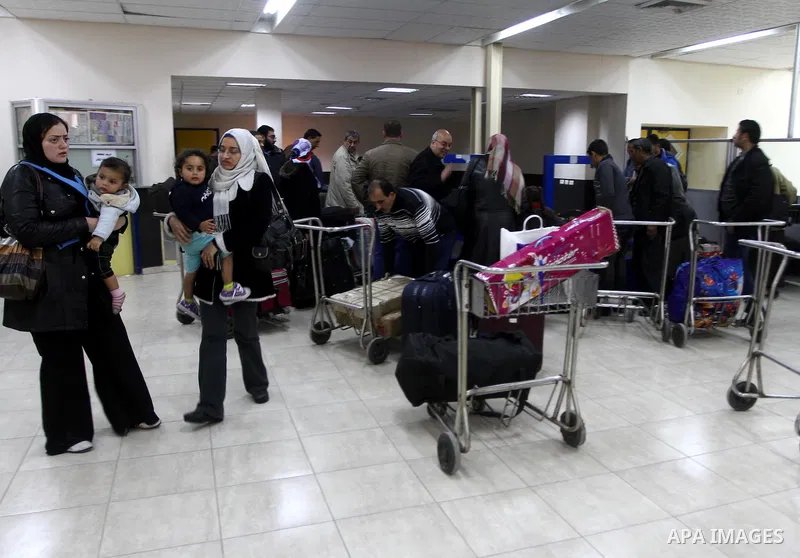 Palestinians returning from Egypt cross through the Rafah crossing on Feb. 19, 2011. The Egyptian authorities reopened the Rafah crossing on its border with the Gaza Stripe on Friday, the first time after the resignation...