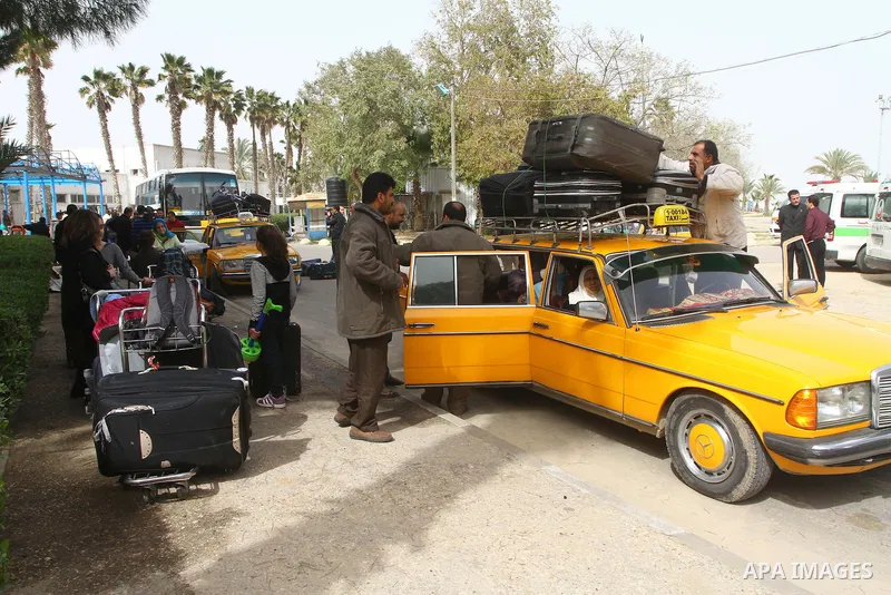 Palestinians returning from Egypt cross through the Rafah crossing on Feb. 19, 2011. The Egyptian authorities reopened the Rafah crossing on its border with the Gaza Stripe on Friday, the first time after the resignation...