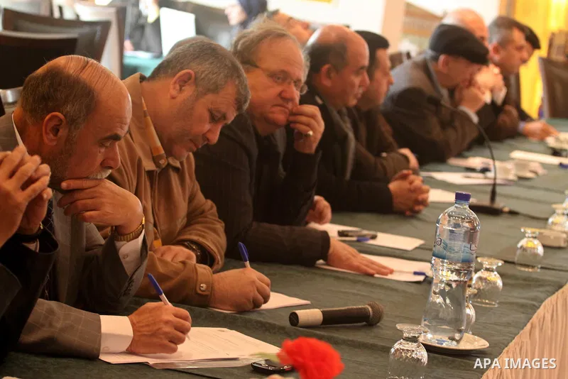 Palestinians attend a meeting to discuss the decision of the Palestinian Authority in the Palestinian elections, in Gaza City on Feb. 20, 2011. Photo by Mohammed Asad