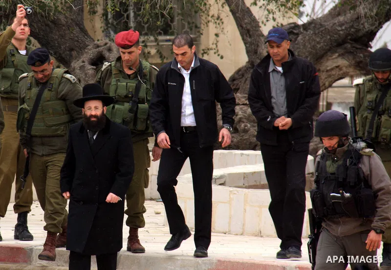 An Israeli Jewish rabbi walks at the entrance of the tomb of the Biblical figure Yehoshua Bin Nun, also know as Joshua, in the West Bank village of Kifl Hareth, near Nablus, Sunday, Feb 20,2011. Photo by Wagdi Eshtayah