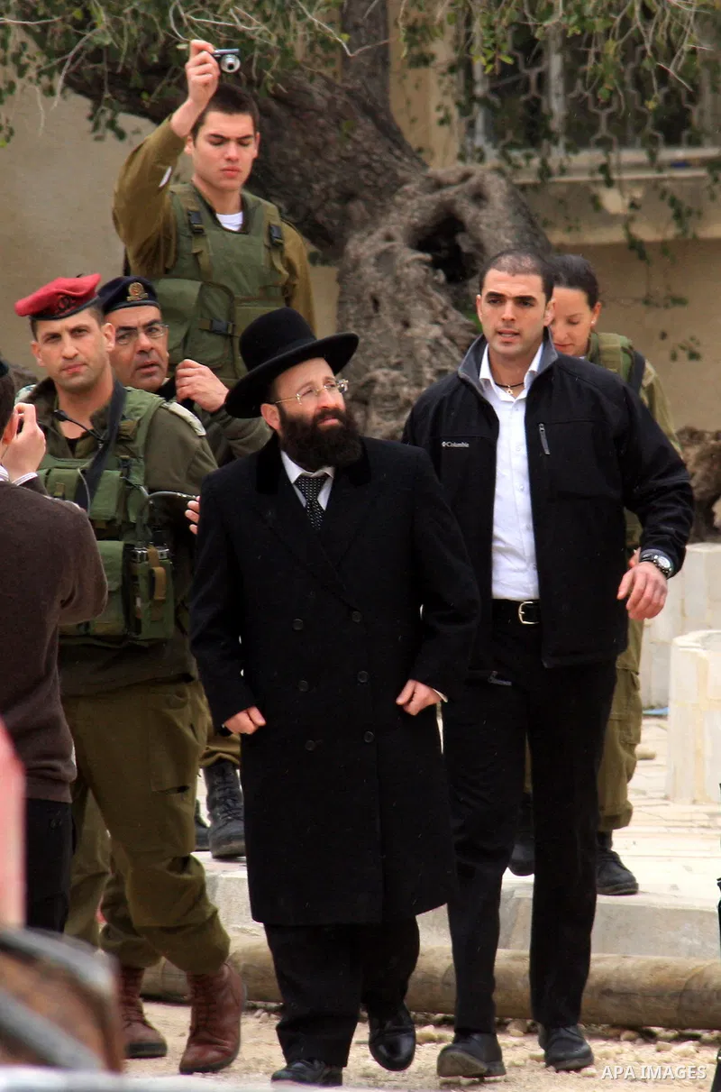 An Israeli Jewish rabbi walks at the entrance of the tomb of the Biblical figure Yehoshua Bin Nun, also know as Joshua, in the West Bank village of Kifl Hareth, near Nablus, Sunday, Feb 20,2011. Photo by Wagdi Eshtayah