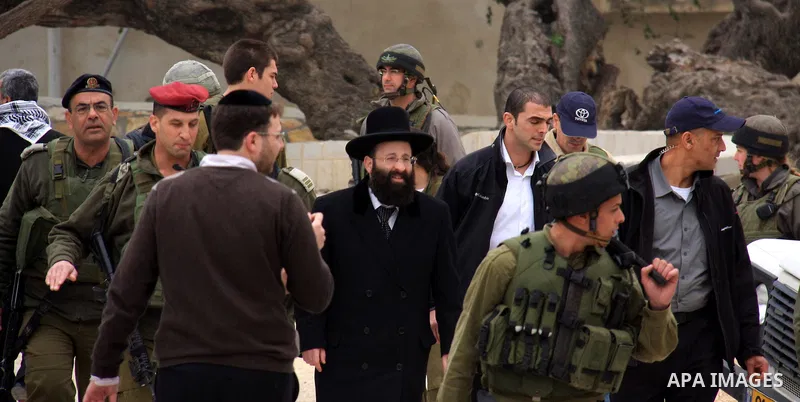 An Israeli Jewish rabbi walks at the entrance of the tomb of the Biblical figure Yehoshua Bin Nun, also know as Joshua, in the West Bank village of Kifl Hareth, near Nablus, Sunday, Feb 20,2011. Photo by Wagdi Eshtayah