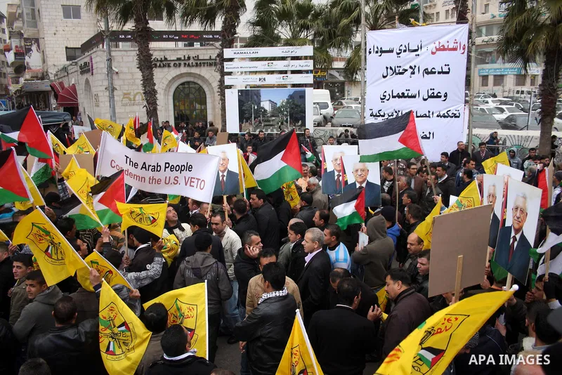 Palestinians demonstrate against the U.S. for vetoing the Arab-backed Security Council resolution against Jewish settlements, in the West Bank city of Ramallah, Sunday, Feb. 20, 2011. Palestinians with backing from much...