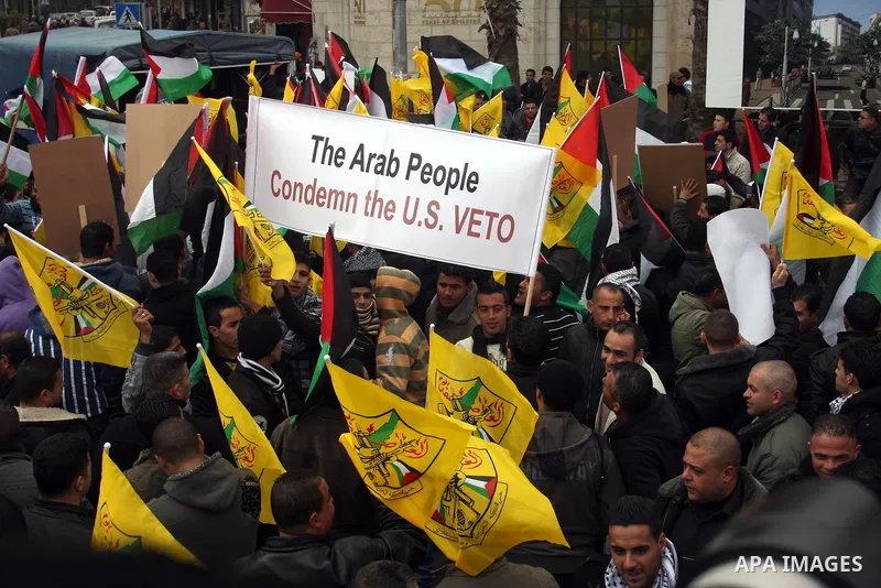 Palestinians demonstrate against the U.S. for vetoing the Arab-backed Security Council resolution against Jewish settlements, in the West Bank city of Ramallah, Sunday, Feb. 20, 2011. Palestinians with backing from much...