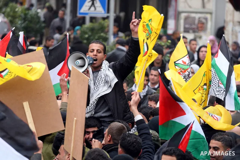 Palestinians demonstrate against the U.S. for vetoing the Arab-backed Security Council resolution against Jewish settlements, in the West Bank city of Ramallah, Sunday, Feb. 20, 2011. Palestinians with backing from much...