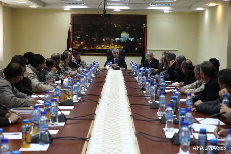 Palestinian prime minister Salam Fayyad, during a consultation meeting with members of the popular committees against the Israeli separation barrier and settlements, about the formation of the new government, in the West...