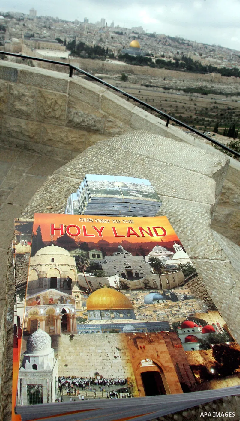 A book is seen near the Dome of the Rock at the Al-Aqsa Mosque compound in Jerusalem on Feb. 21,2011. Photo by Mahfouz Abu Turk