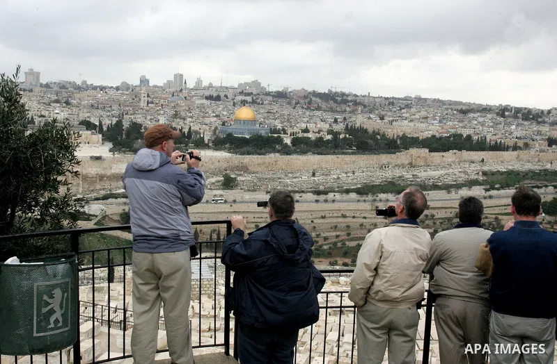 Foreign tourists take picture for the Dome of the Rock at the Al-Aqsa Mosque compound in Jerusalem on Feb. 21,2011. Photo by Mahfouz Abu Turk