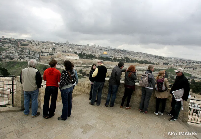 Foreign tourists take picture for the Dome of the Rock at the Al-Aqsa Mosque compound in Jerusalem on Feb. 21,2011. Photo by Mahfouz Abu Turk