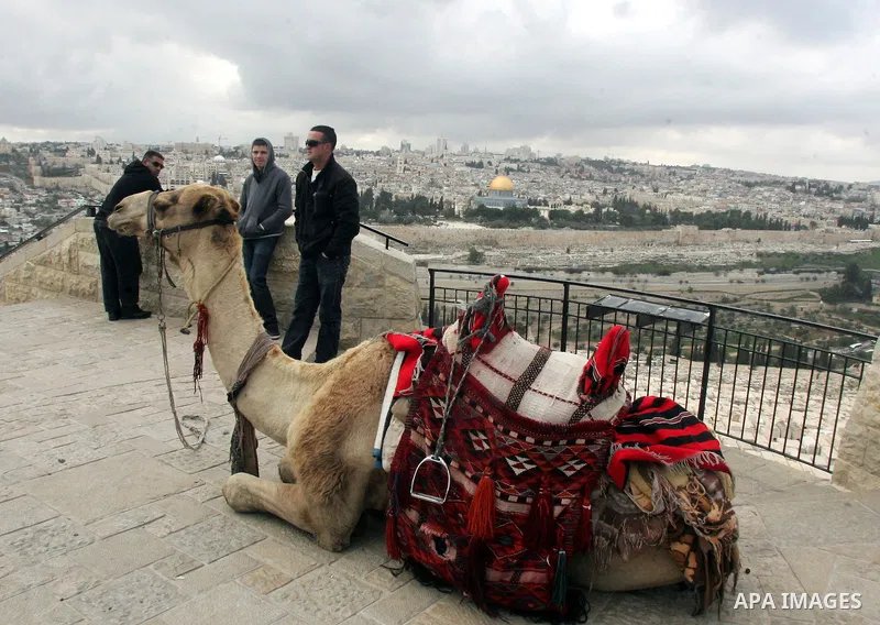 Foreign tourists take picture for the Dome of the Rock at the Al-Aqsa Mosque compound in Jerusalem on Feb. 21,2011. Photo by Mahfouz Abu Turk