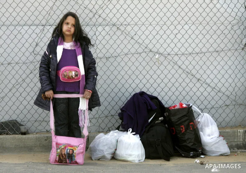 Palestinians arrive to the Gaza Strip through the Rafah border crossing with Egypt, in southern Gaza, on February 22, 2011 after it was opened for passage for people leaving and entering the Palestinian enclave. Photo by...