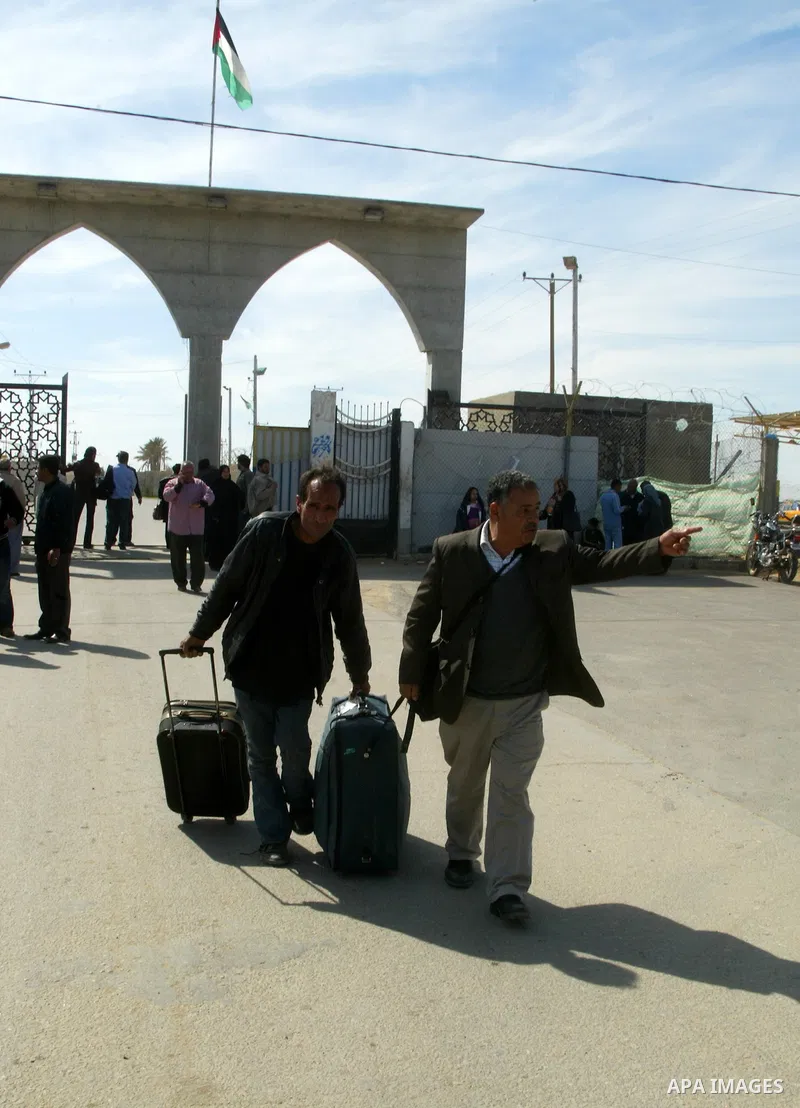 Palestinians arrive to the Gaza Strip through the Rafah border crossing with Egypt, in southern Gaza, on February 22, 2011 after it was opened for passage for people leaving and entering the Palestinian enclave. Photo by...
