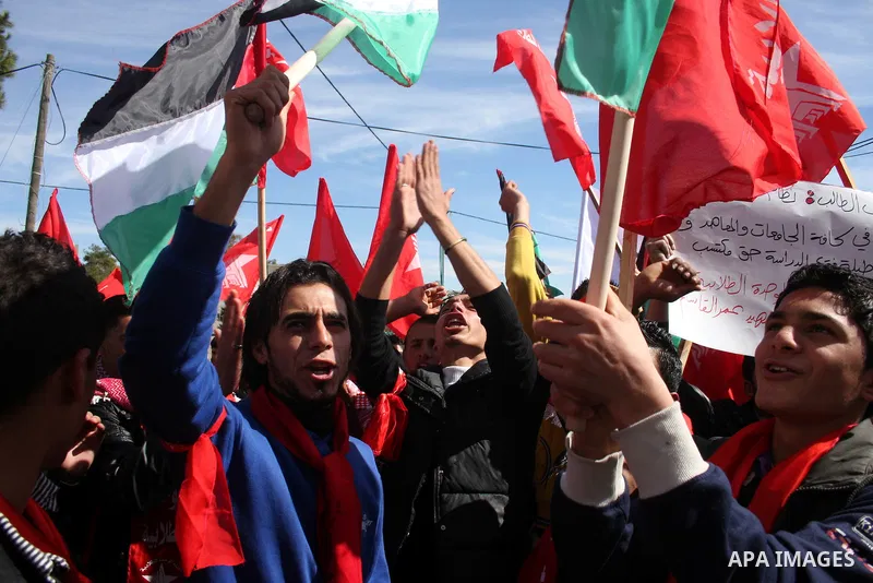 Palestinian universities students take part in a protest calling for the adoption of the National Fund for Education in the West Bank city of Ramallah on Feb. 22,2011. Photo by Issam Rimawi