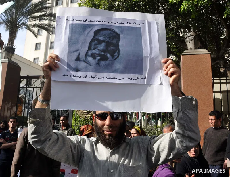 Protesters take part in a protest against Libyan Leader Moammar Gadhafi in front of the Arab league in Cairo, Egypt, Feb. 22, 2011. Protesters gathered at the protest against Gadhafi's crackdown on peaceful protesters in...