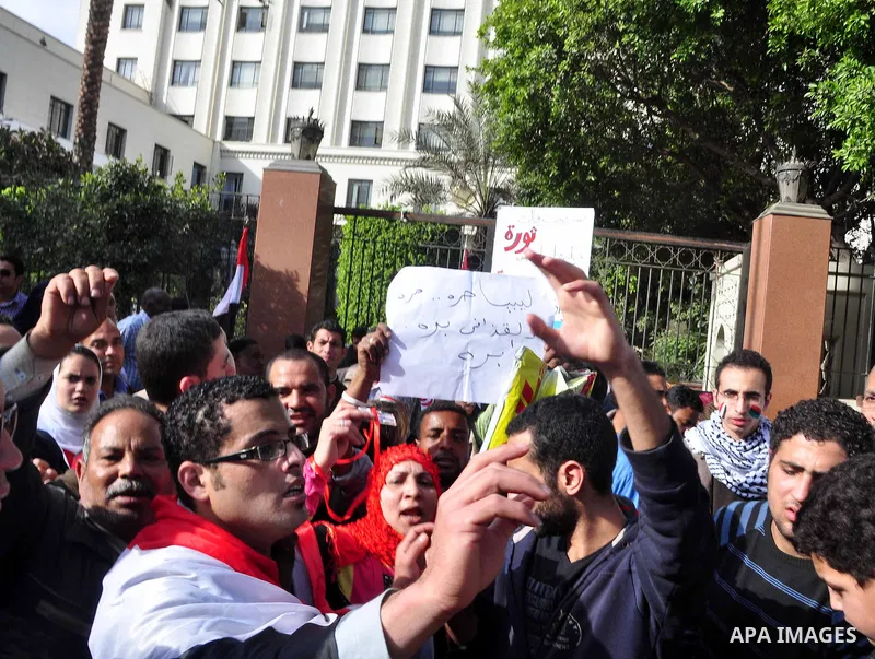 Protesters take part in a protest against Libyan Leader Moammar Gadhafi in front of the Arab league in Cairo, Egypt, Feb. 22, 2011. Protesters gathered at the protest against Gadhafi's crackdown on peaceful protesters in...