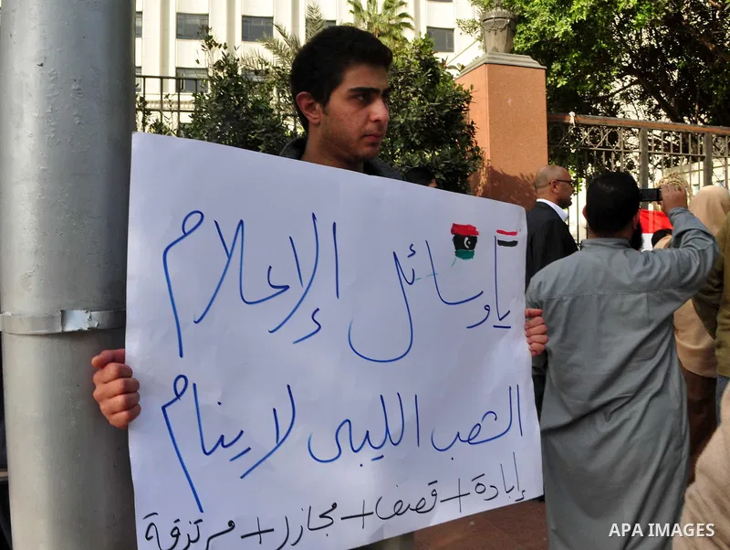 Protesters take part in a protest against Libyan Leader Moammar Gadhafi in front of the Arab league in Cairo, Egypt, Feb. 22, 2011. Protesters gathered at the protest against Gadhafi's crackdown on peaceful protesters in...
