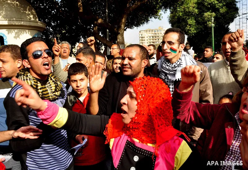 Protesters take part in a protest against Libyan Leader Moammar Gadhafi in front of the Arab league in Cairo, Egypt, Feb. 22, 2011. Protesters gathered at the protest against Gadhafi's crackdown on peaceful protesters in...