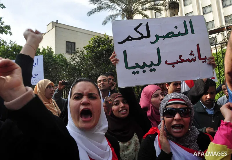Protesters take part in a protest against Libyan Leader Moammar Gadhafi in front of the Arab league in Cairo, Egypt, Feb. 22, 2011. Protesters gathered at the protest against Gadhafi's crackdown on peaceful protesters in...