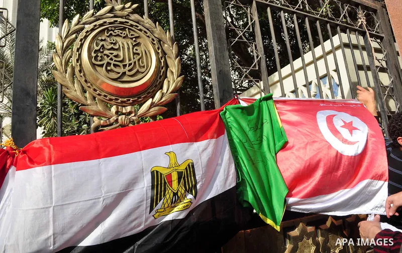 Protesters take part in a protest against Libyan Leader Moammar Gadhafi in front of the Arab league in Cairo, Egypt, Feb. 22, 2011. Protesters gathered at the protest against Gadhafi's crackdown on peaceful protesters in...
