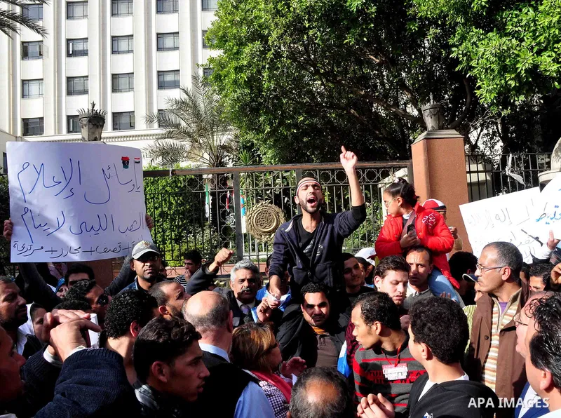 Protesters take part in a protest against Libyan Leader Moammar Gadhafi in front of the Arab league in Cairo, Egypt, Feb. 22, 2011. Protesters gathered at the protest against Gadhafi's crackdown on peaceful protesters in...