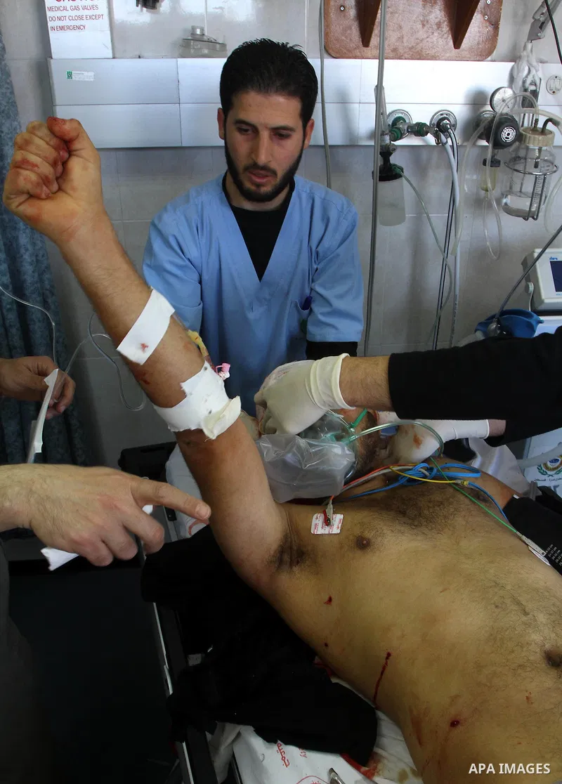 A wounded Palestinian man receives treatment into al-Shefa hospital in Gaza City on Feb. 23, 2011. Eleven Palestinians were wounded Wednesday by Israeli artillery shelling in Gaza City, witnesses and medical sources said...