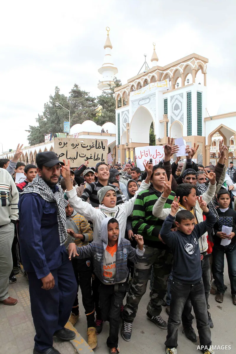 People attend a protest in the eastern Libyan town of Derna on Feb. 23, 2011. Unrest shook Libya in recent days as government crackdowns on protesters have resulted in mass casualties, according to human rights groups. P...
