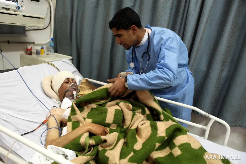 An injured anti-government protester receives treatment at a hospital in the eastern Libyan town of Derna on Feb. 23, 2011. Unrest shook Libya in recent days as government crackdowns on protesters have resulted in mass c...