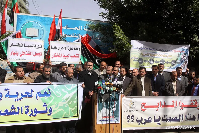 Palestinians take part in a protest to show solidarity with Libyan people, in Gaza city on Feb. 24, 2011. Photo by Mohammed Asad