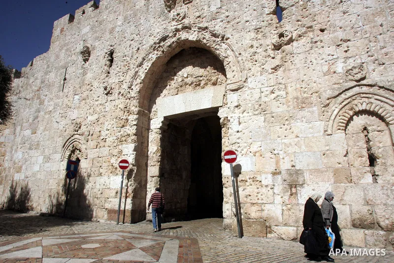 Palestinians walk past the David's gate, just outside Jerusalem's Old City on Feb. 24, 2011. Photo by Mahfouz Abu Turk