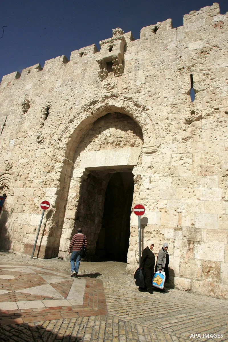 Palestinians walk past the David's gate, just outside Jerusalem's Old City on Feb. 24, 2011. Photo by Mahfouz Abu Turk