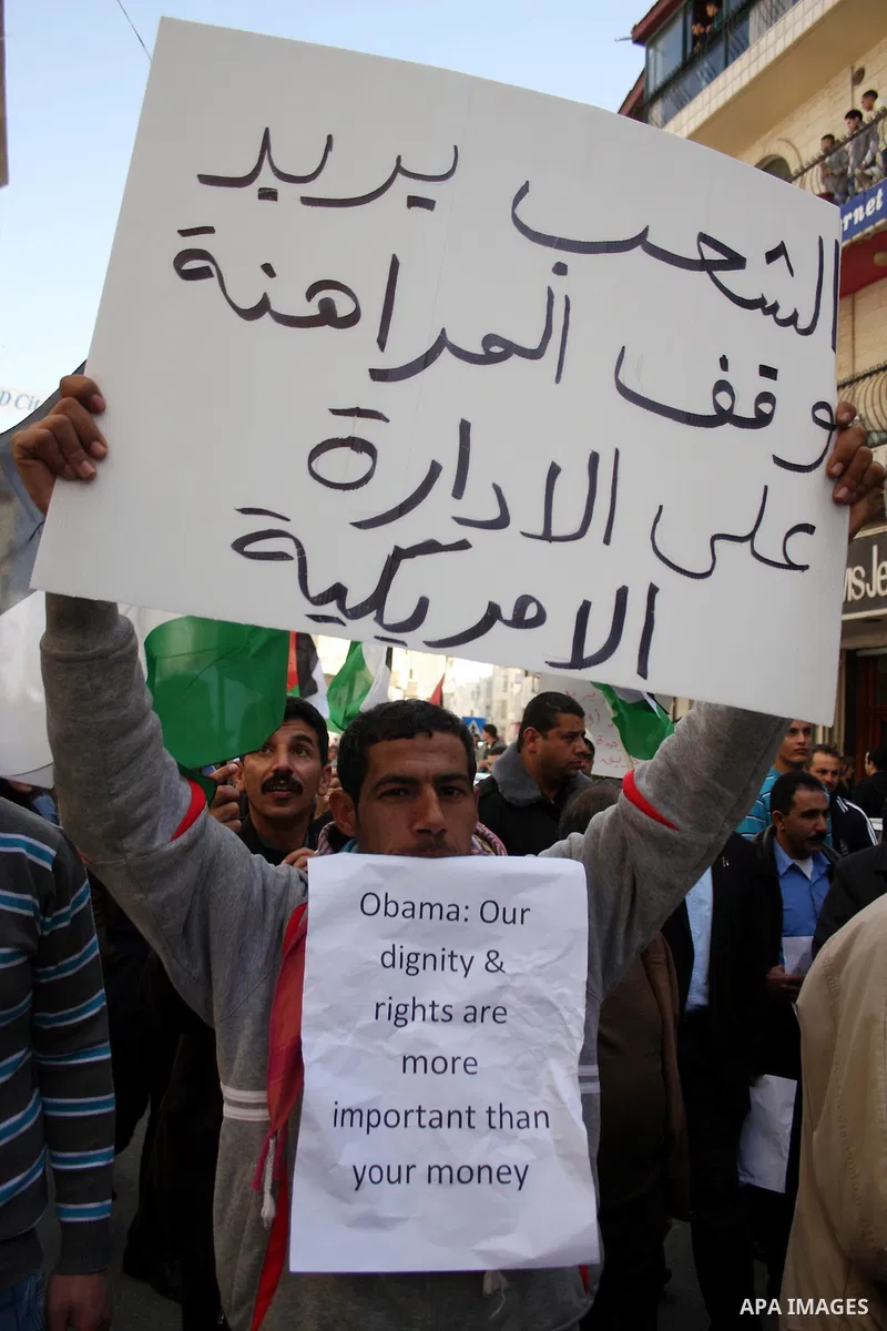 Palestinians take part in a rally calling for ending the Palestinian division, in the West Bank city of Ramallah on Feb.24, 2011. More than 3000 protesters call for free elections and the reconciliation between the two r...