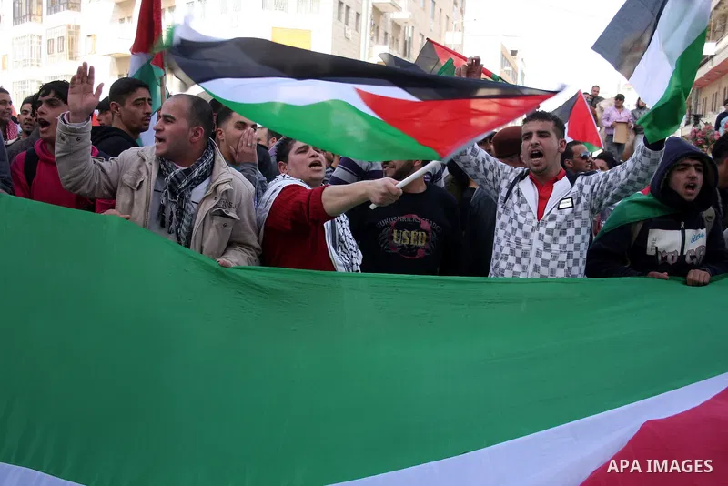 Palestinians take part in a rally calling for ending the Palestinian division, in the West Bank city of Ramallah on Feb. 24, 2011. More than 3000 protesters call for free elections and the reconciliation between the two...