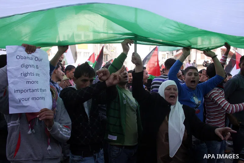 Palestinians take part in a rally calling for ending the Palestinian division, in the West Bank city of Ramallah on Feb. 27, 2011. More than 3000 protesters call for free elections and the reconciliation between the two...