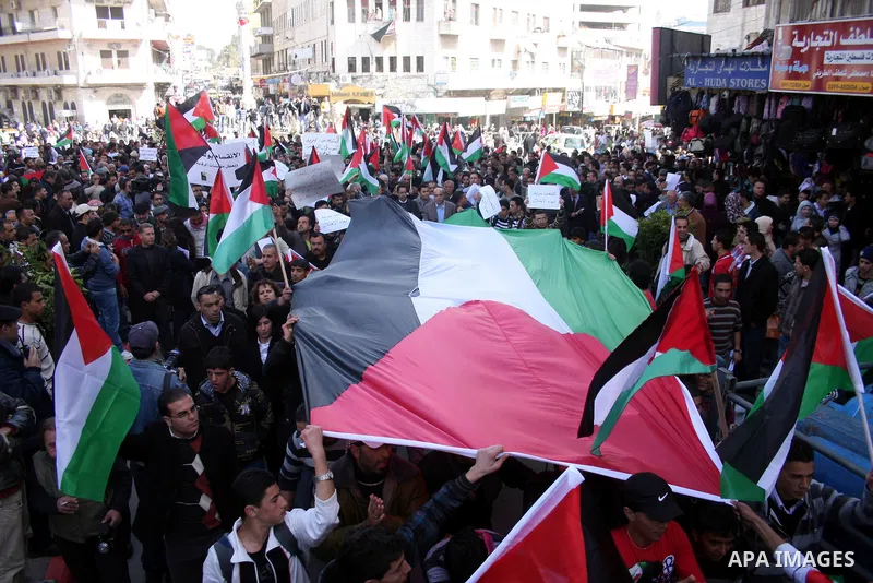 Palestinians take part in a rally calling for ending the Palestinian division, in the West Bank city of Ramallah on Feb. 24, 2011. More than 3000 protesters call for free elections and the reconciliation between the two...
