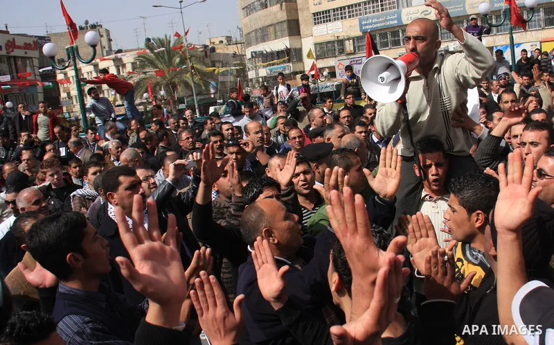 Palestinian protesters take part in a rally against the U.S. veto and calling for the national reconciliation in the West Bank city of Nablus, Thursday, Feb. 24, 2011. Photo by Wagdi Eshtayah