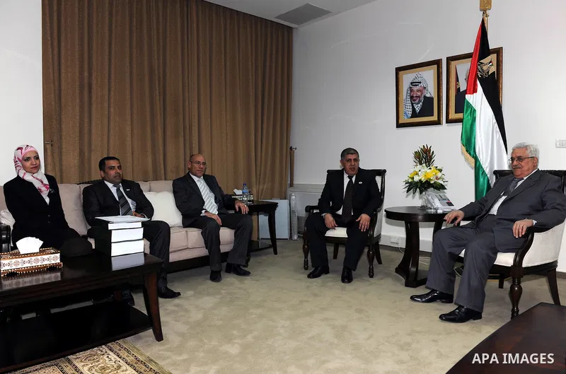 Palestinian President Mahmoud Abbas receives the annual report of the council of administrative and financial control in the West bank city of Ramallah on Feb. 24, 2011. Photo by Thaer Ganaim