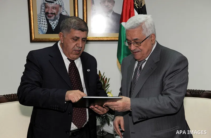 Palestinian President Mahmoud Abbas receives the annual report of the council of administrative and financial control in the West bank city of Ramallah on Feb. 24, 2011. Photo by Thaer Ganaim
