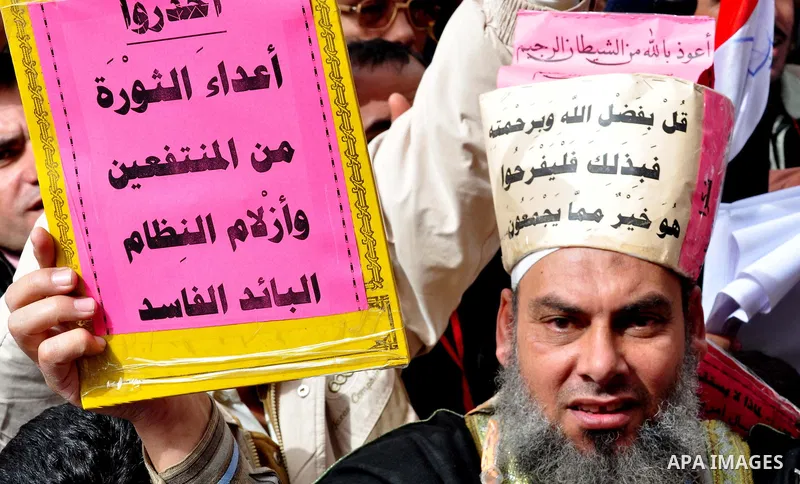 Egyptian protesters take part in a demonstration and Friday prayers in Tahrir Square, Cairo, Egypt, Friday, Feb. 25, 2011. Tens of thousands rallied in Cairo's Tahrir Square on Friday, trying to keep up pressure on Egypt...