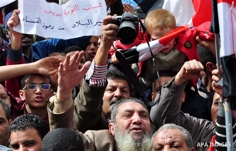 Egyptian protesters take part in a demonstration and Friday prayers in Tahrir Square, Cairo, Egypt, Friday, Feb. 25, 2011. Tens of thousands rallied in Cairo's Tahrir Square on Friday, trying to keep up pressure on Egypt...