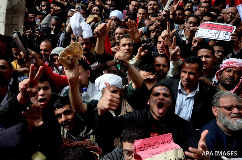 Egyptian protesters take part in a demonstration and Friday prayers in Tahrir Square, Cairo, Egypt, Friday, Feb. 25, 2011. Tens of thousands rallied in Cairo's Tahrir Square on Friday, trying to keep up pressure on Egypt...