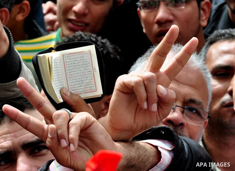 Egyptian protesters take part in a demonstration and Friday prayers in Tahrir Square, Cairo, Egypt, Friday, Feb. 25, 2011. Tens of thousands rallied in Cairo's Tahrir Square on Friday, trying to keep up pressure on Egypt...