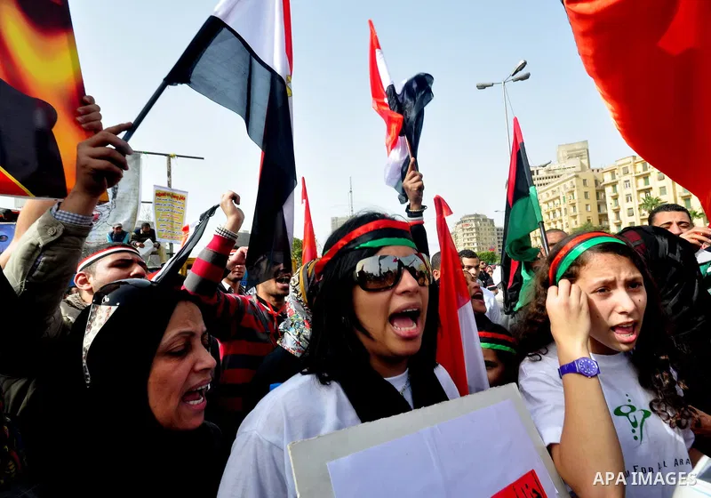 Egyptian protesters take part in a demonstration and Friday prayers in Tahrir Square, Cairo, Egypt, Friday, Feb. 25, 2011. Tens of thousands rallied in Cairo's Tahrir Square on Friday, trying to keep up pressure on Egypt...